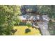 Charming brick home with a well-manicured lawn, covered entryway, and a refreshing pool in the backyard at 240 China Grove Rd, China Grove, NC 28123