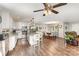 Open-concept kitchen with white cabinets, stainless steel appliances, and an island with seating at 240 China Grove Rd, China Grove, NC 28123