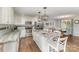 Renovated kitchen featuring granite countertops, white cabinets, stainless steel appliances, and a peninsula at 240 China Grove Rd, China Grove, NC 28123