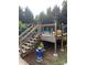 Above-ground pool with surrounding deck and stairs at 240 China Grove Rd, China Grove, NC 28123