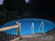 Pool at night showing the pool illuminated at 240 China Grove Rd, China Grove, NC 28123