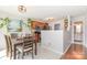 Bright dining area connected to the kitchen featuring stainless steel appliances and wooden cabinets at 2636 Forest Grove Ct, Charlotte, NC 28269