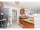 Functional kitchen area with granite countertops, wooden cabinets, and stainless steel appliances at 2636 Forest Grove Ct, Charlotte, NC 28269