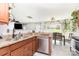 Updated kitchen featuring granite countertops, stainless steel appliances, and bright natural light at 2636 Forest Grove Ct, Charlotte, NC 28269
