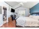 Spacious main bedroom with a dark accent wall, hardwood floors and an attached bathroom at 2636 Forest Grove Ct, Charlotte, NC 28269