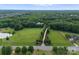 Sprawling property with a long private drive leading to a grand estate surrounded by lush greenery and beautiful landscapes at 2926 Crane Rd, Waxhaw, NC 28173