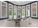 A refined dining area features a quartz table, pendant lights, and large windows for a bright, inviting space at 2926 Crane Rd, Waxhaw, NC 28173