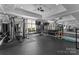 Bright home gym features ample equipment, mirrored walls, and rubber flooring for a complete fitness experience at 2926 Crane Rd, Waxhaw, NC 28173