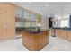 A spacious kitchen with an island, granite countertops, modern appliances, and sleek cabinetry at 2926 Crane Rd, Waxhaw, NC 28173
