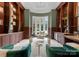 Elegant office with built-in bookshelves, wainscoting, marble floors, and lots of natural light at 2926 Crane Rd, Waxhaw, NC 28173