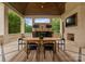 Covered outdoor dining area with a bar, fireplace and television for relaxation at 2926 Crane Rd, Waxhaw, NC 28173