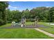 Inviting backyard playground with a slide, swings, and climbing structures surrounded by a soft landing surface at 2926 Crane Rd, Waxhaw, NC 28173