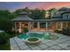 Swimming pool and patio of this luxury residence with covered outdoor living spaces with amazing columns at 2926 Crane Rd, Waxhaw, NC 28173