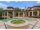 Outdoor pool and spa with travertine tile surround and covered patio area, perfect for entertaining at 2926 Crane Rd, Waxhaw, NC 28173