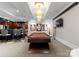 Recreation room with a pool table, wet bar, and media area for entertaining guests at 2926 Crane Rd, Waxhaw, NC 28173