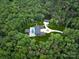 Aerial view of a large home and property surrounded by lush green forest at 3020 Brooks Mill Ln, Wingate, NC 28174