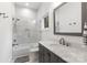 Modern bathroom featuring a shower over tub and gray vanity at 3020 Brooks Mill Ln, Wingate, NC 28174