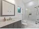 Stylish bathroom with sleek gray vanity and shower over tub combo at 3020 Brooks Mill Ln, Wingate, NC 28174