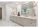Bathroom featuring a double vanity with marble countertops, large mirrors, and decorative lighting fixtures at 3020 Brooks Mill Ln, Wingate, NC 28174