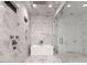 Modern bathroom featuring marble tiling, a sleek tub, and a glass-enclosed shower at 3020 Brooks Mill Ln, Wingate, NC 28174