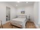 Bright bedroom with ensuite bathroom, wood floors, and lots of natural light at 3020 Brooks Mill Ln, Wingate, NC 28174