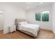 Elegant bedroom with a tufted headboard and hardwood flooring at 3020 Brooks Mill Ln, Wingate, NC 28174