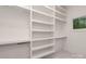 Walk-in closet with built-in shelving and ample storage space at 3020 Brooks Mill Ln, Wingate, NC 28174