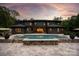 Luxury home featuring a large pool, stone accents, and an expansive backyard at 3020 Brooks Mill Ln, Wingate, NC 28174