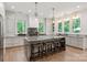 Gourmet kitchen featuring a large island, marble countertops, and high-end appliances at 3020 Brooks Mill Ln, Wingate, NC 28174