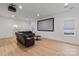 Spacious living room with a home theater setup and leather reclining sofa at 3020 Brooks Mill Ln, Wingate, NC 28174