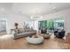 Bright and airy living room with a view to an outdoor patio and elegant decor at 3020 Brooks Mill Ln, Wingate, NC 28174