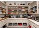 Organized walk-in pantry with shelving and storage for kitchen essentials at 3020 Brooks Mill Ln, Wingate, NC 28174
