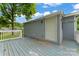 Exterior back deck of home with light blue siding and white trim, a great space to relax at 3400 Reid Ave, Charlotte, NC 28208