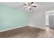 Bedroom featuring a ceiling fan and wood-look flooring at 3400 Reid Ave, Charlotte, NC 28208