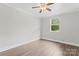Neutral bedroom with wood-look floors, neutral paint, and natural light at 3400 Reid Ave, Charlotte, NC 28208