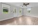 Bright living room with wood-look floors, neutral paint, with front door entrance and natural light at 3400 Reid Ave, Charlotte, NC 28208