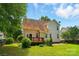 Well-maintained backyard with a wooden deck and lush landscaping at 3912 Grace Ct, Indian Trail, NC 28079