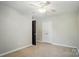 Cozy bedroom featuring neutral walls, ceiling fan, carpet, and closet space at 3912 Grace Ct, Indian Trail, NC 28079