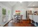 Bright dining area features hardwood floors, a round table, and natural light at 3912 Grace Ct, Indian Trail, NC 28079