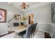 Elegant dining room featuring a chandelier and stylish gray chairs at 3912 Grace Ct, Indian Trail, NC 28079
