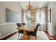 Dining room with chandelier, picture window, painting, and hardwood floor at 3912 Grace Ct, Indian Trail, NC 28079
