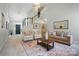 Elegant living room featuring staircase, neutral palette, and modern décor at 3912 Grace Ct, Indian Trail, NC 28079