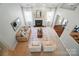 Bright living room with fireplace, large windows, and neutral decor at 3912 Grace Ct, Indian Trail, NC 28079