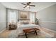 Comfortable main bedroom with ceiling fan and natural light at 3912 Grace Ct, Indian Trail, NC 28079