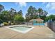 The community pool has a smaller hot tub, as well as lounge chairs and umbrellas at 3912 Grace Ct, Indian Trail, NC 28079