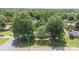 Aerial view of the property showcasing mature trees, a well-manicured lawn, and proximity to the road at 4250 N Center St, Hickory, NC 28601