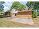 Spacious backyard showcasing a concrete patio and basketball court surrounded by greenery at 4250 N Center St, Hickory, NC 28601