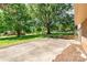Expansive backyard with a concrete patio area and mature trees offering plenty of shade at 4250 N Center St, Hickory, NC 28601