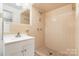 Bathroom features neutral tile, vanity, and a standing shower with plenty of space at 4250 N Center St, Hickory, NC 28601