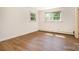 Spacious bedroom with hardwood floors and great natural light from two large windows at 4250 N Center St, Hickory, NC 28601